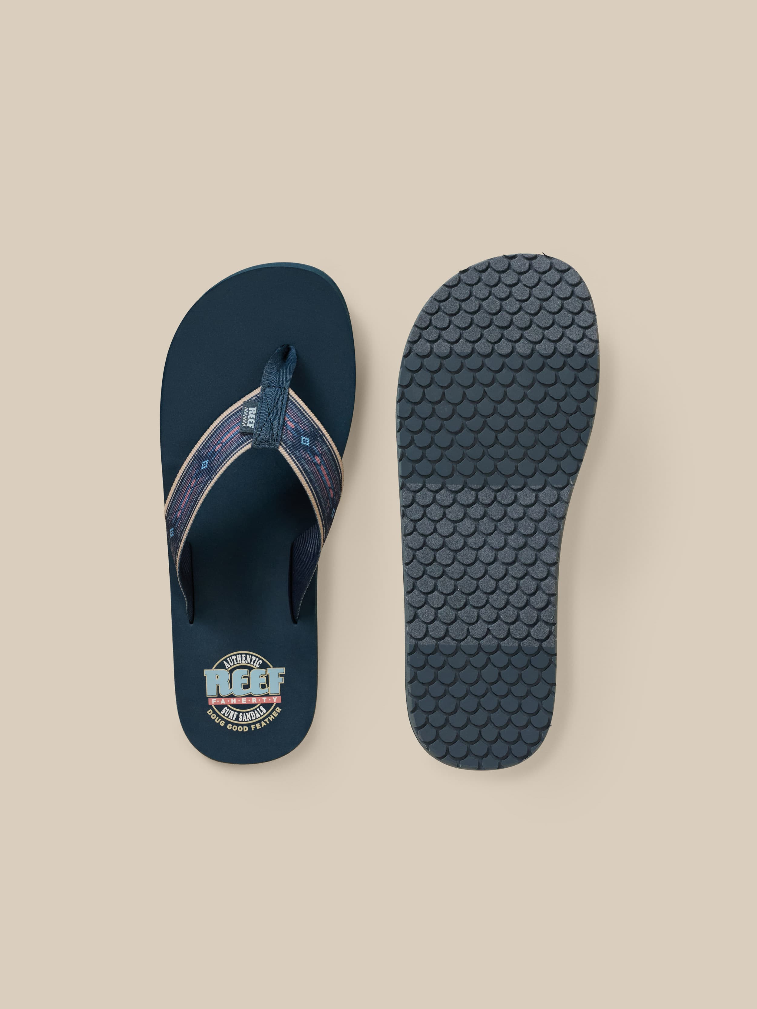 Pair of blue flip-flops with a Faherty x REEF brand logo on a beige background