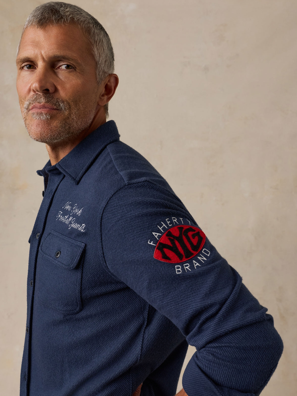 Man wearing a NY Giants button up shirt , image 3 of 7