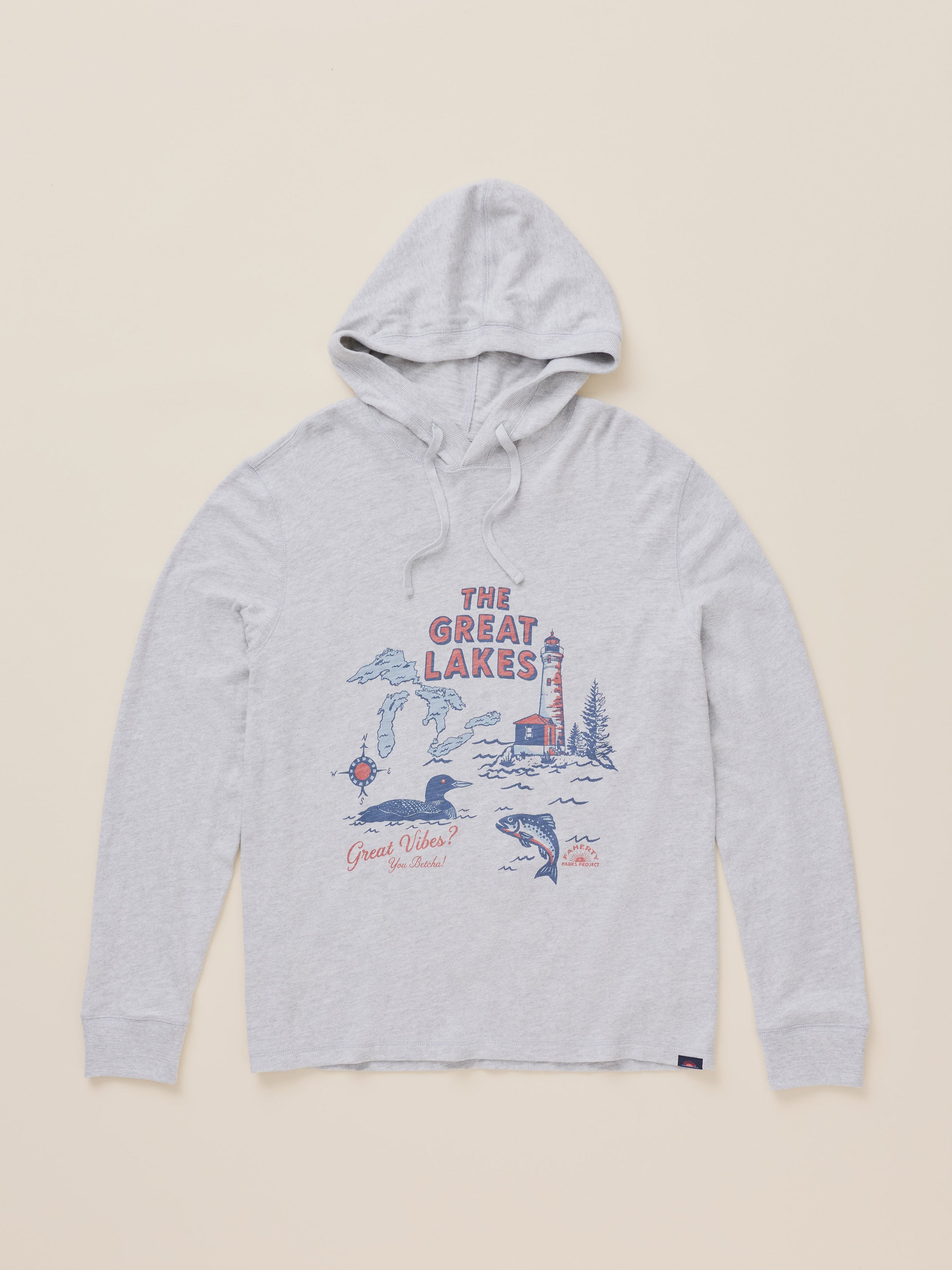 A light heather gray pullover hoodie with a vintage-style 'The Great Lakes' graphic on the chest, featuring red and blue illustrations of a lighthouse, ducks, and water, laid flat against a solid beige background.