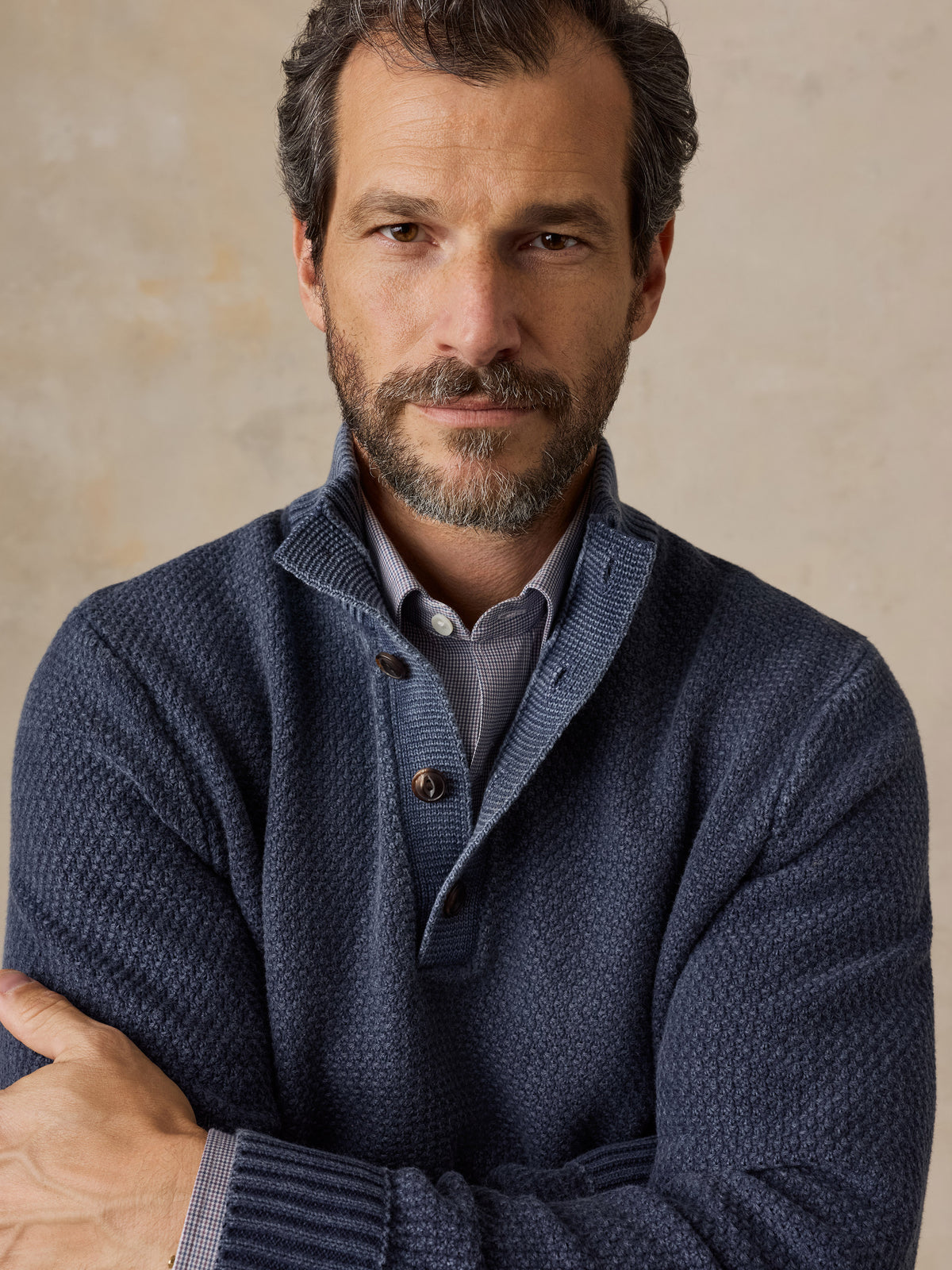 Close up of a man wearing a blue button up sweater, image 3 of 5