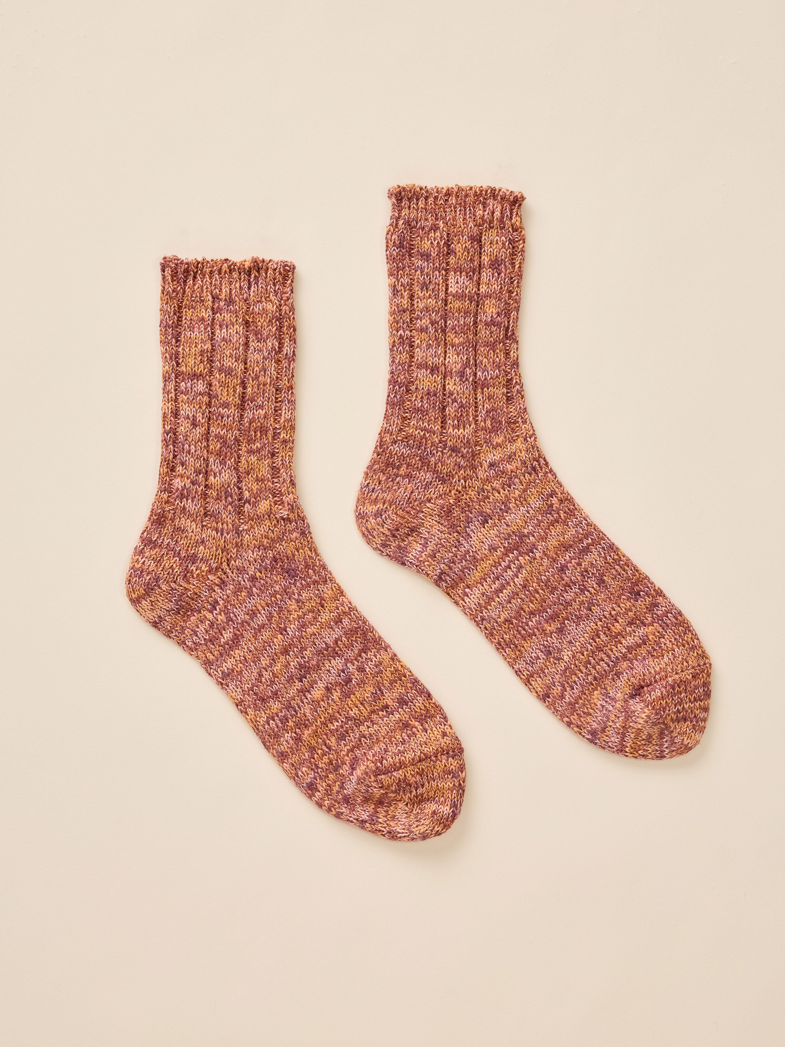 A pair of orange marled socks