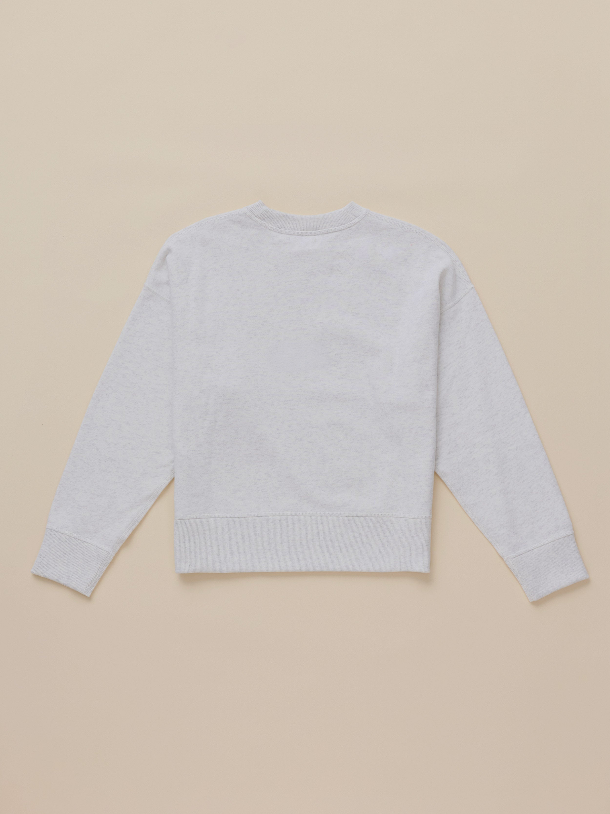 A light gray heather crewneck sweatshirt shown from the back, laid flat on a solid beige background.
